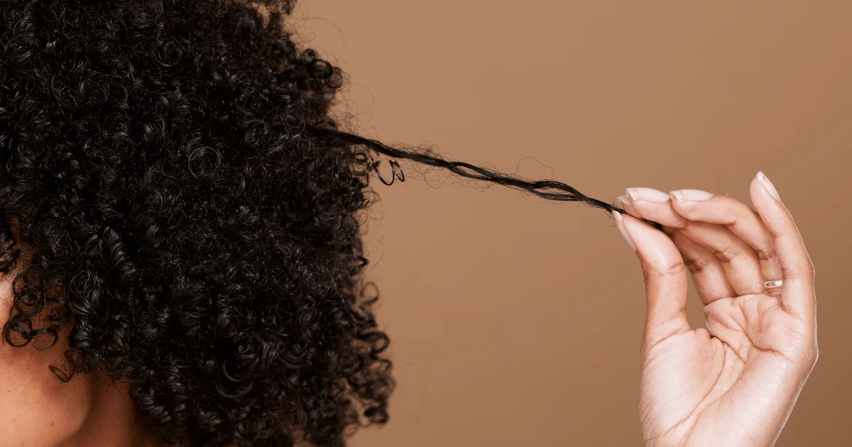 woman stretching out her hair lustrates in hair for illustrating here for porosity