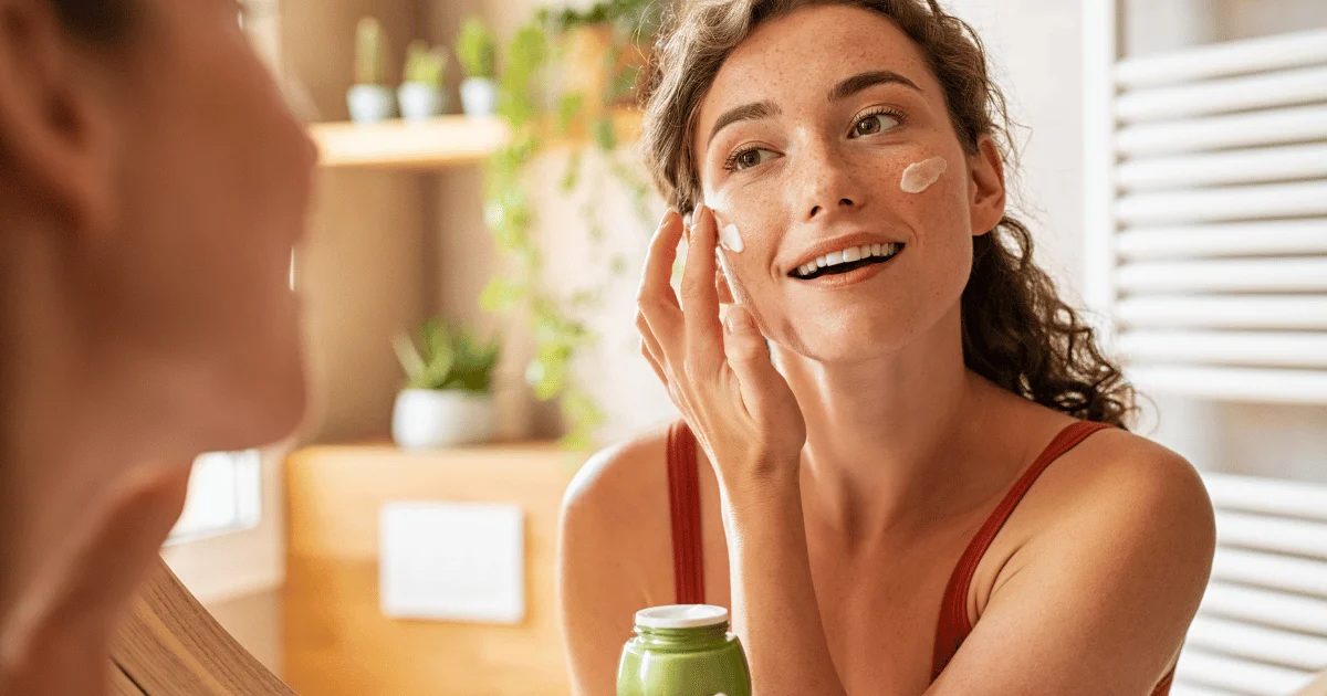 woman applying skincare moisturizer for radiant skin